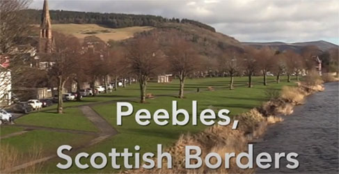 A river with park land and trees