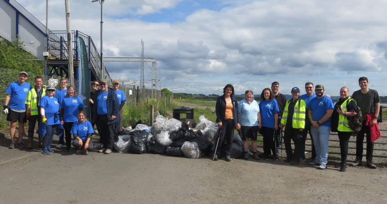 Volunteers with bags of rubbish collected on Craigendoran Beach