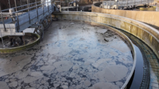 A settlement tank at Kemnay's Waste Water Treatment Works after being affected by unexplained variation in the incoming waste water that the site receives. The water at the top of the tank which would normally be clear shows a floating layer.